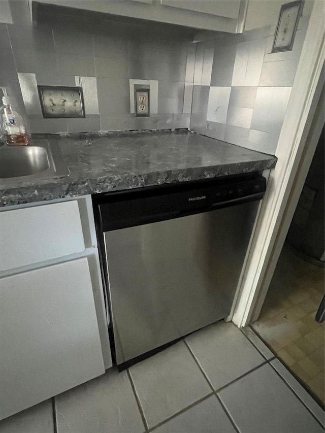 9226 Jollyville Rd Unit 121, Austin, TX 78759 - kitchen featuring stainless steel dishwasher, decorative backsplash, light tile patterned floors, and a sink