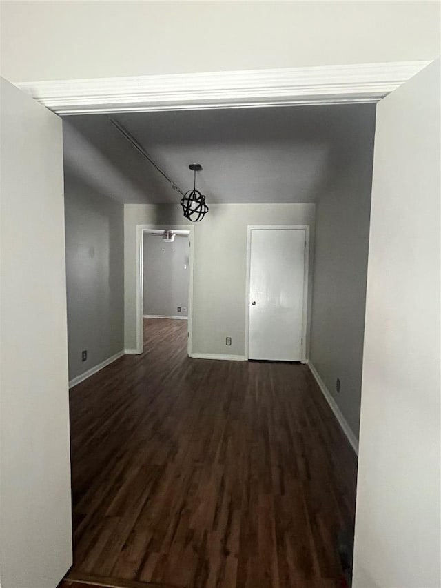 9226 Jollyville Rd Unit 121, Austin, TX 78759 - unfurnished dining area featuring dark wood-style flooring and baseboards
