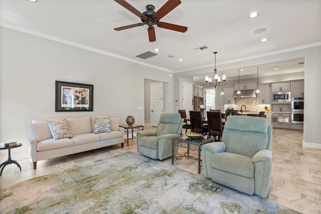 living room featuring visible vents, crown molding, and baseboards