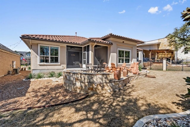 back of property with a patio, fence, a tile roof, and stucco siding