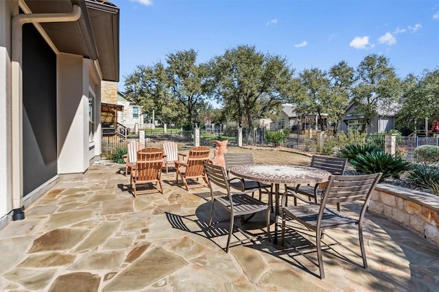 view of patio / terrace with outdoor dining area and fence