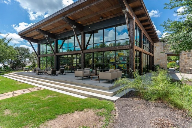 view of property's community with a patio area and outdoor lounge area