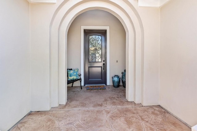 entrance to property with stucco siding