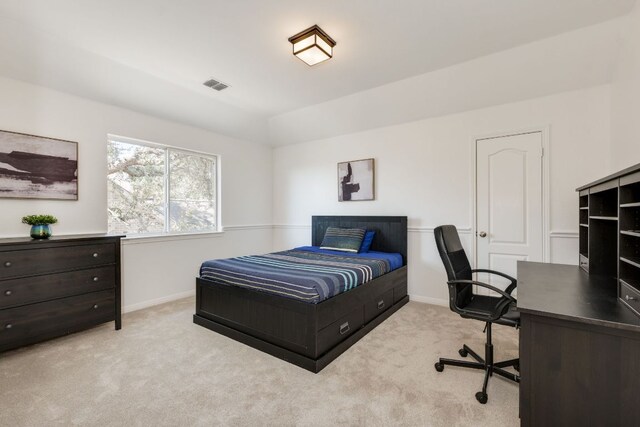 bedroom with carpet, visible vents, vaulted ceiling, and baseboards