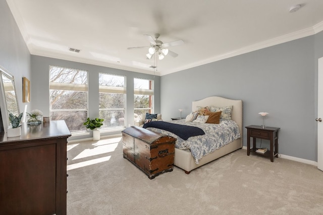 bedroom featuring crown molding, baseboards, visible vents, and light colored carpet