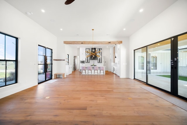 23937 Oscar Rd, Spicewood, TX 78669 - unfurnished room featuring light wood finished floors, a chandelier, and recessed lighting