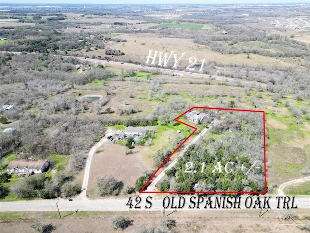 birds eye view of property featuring a rural view