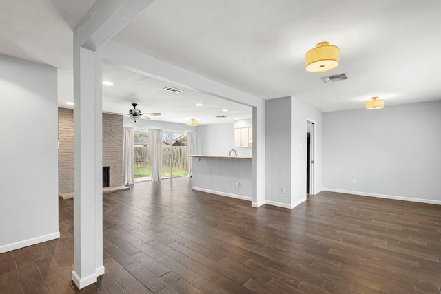12314 Double Tree Ln, Austin, TX 78750 - unfurnished living room featuring a ceiling fan, dark wood-style floors, baseboards, recessed lighting, and a fireplace