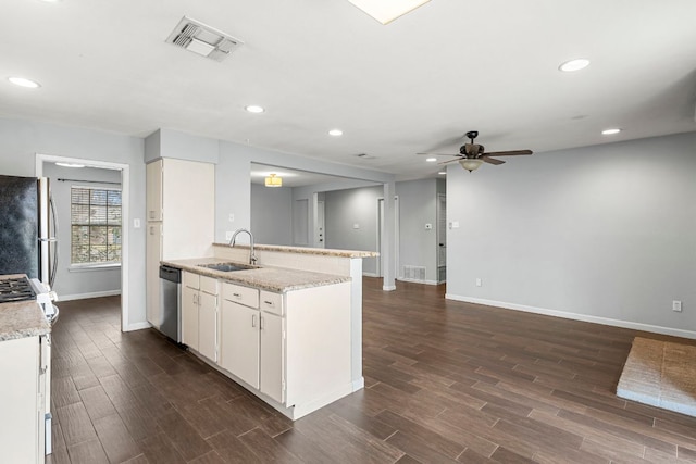 12314 Double Tree Ln, Austin, TX 78750 - kitchen with a sink, appliances with stainless steel finishes, ceiling fan, baseboards, and dark wood finished floors