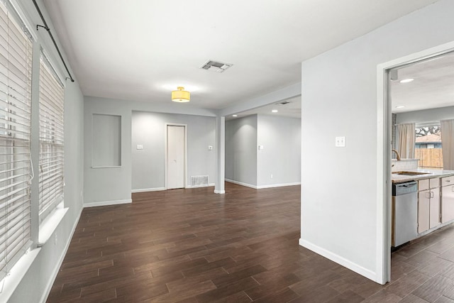 12314 Double Tree Ln, Austin, TX 78750 - empty room with a sink, dark wood finished floors, baseboards, and recessed lighting