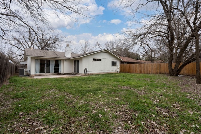 12314 Double Tree Ln, Austin, TX 78750 - rear view of house with central AC unit and a chimney