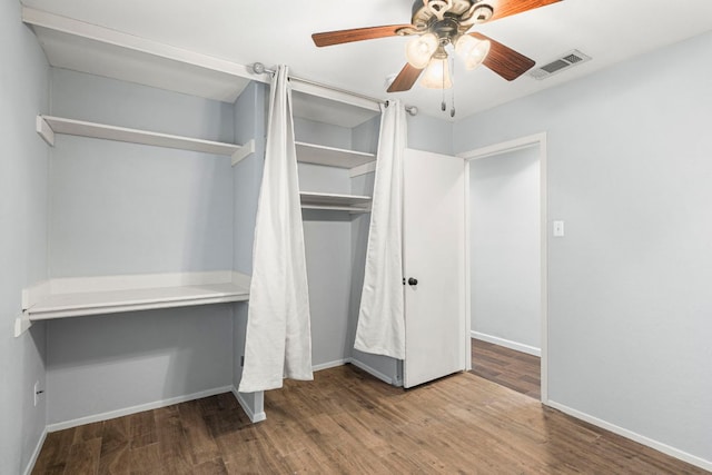 12314 Double Tree Ln, Austin, TX 78750 - unfurnished bedroom featuring wood finished floors, baseboards, a closet, and a ceiling fan