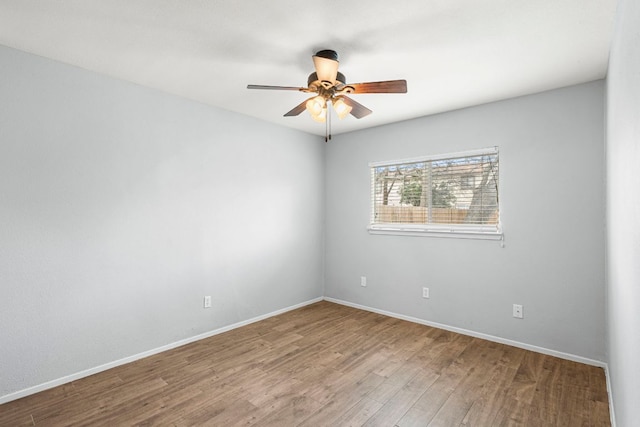 12314 Double Tree Ln, Austin, TX 78750 - empty room with a ceiling fan, wood finished floors, and baseboards
