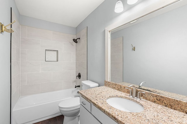12314 Double Tree Ln, Austin, TX 78750 - bathroom featuring toilet, wood finished floors, vanity, and shower / washtub combination
