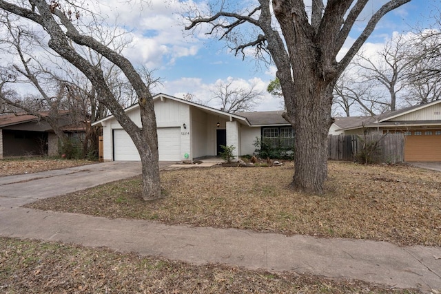 12314 Double Tree Ln, Austin, TX 78750 - mid-century inspired home featuring a garage and concrete driveway
