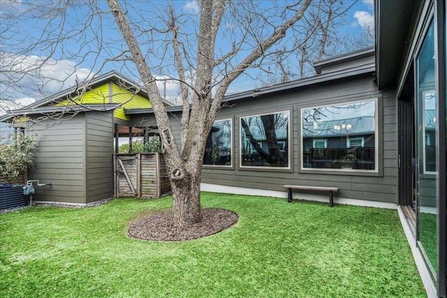 4404 Clarkson Ave, Austin, TX 78751 - rear view of house featuring a lawn