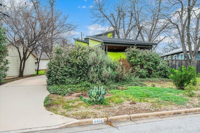 view of front of house featuring fence