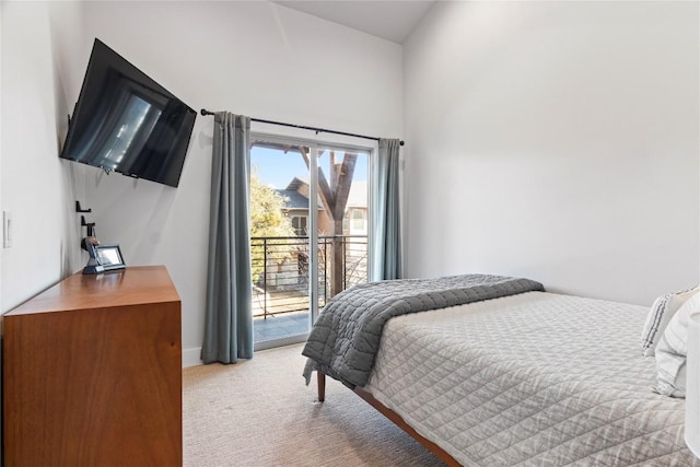 bedroom featuring access to outside and light carpet