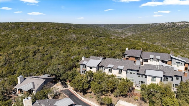 aerial view featuring a residential view and a wooded view