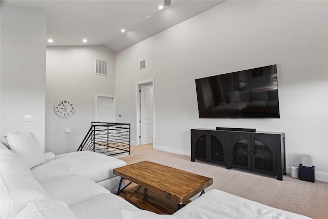 living room featuring carpet, visible vents, baseboards, and recessed lighting