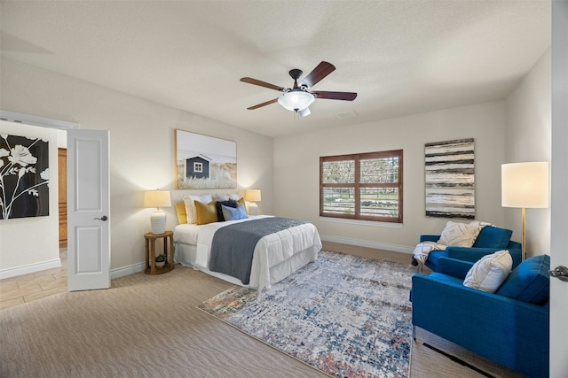 bedroom featuring ceiling fan, carpet flooring, and baseboards