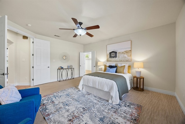 bedroom with ceiling fan, visible vents, and baseboards