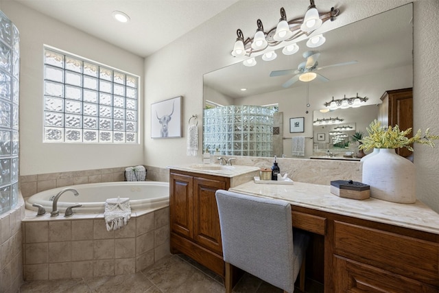 bathroom with ceiling fan, a garden tub, vanity, tiled shower, and tile patterned floors