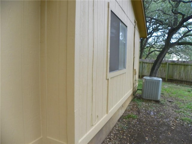 view of home's exterior featuring fence and central air condition unit