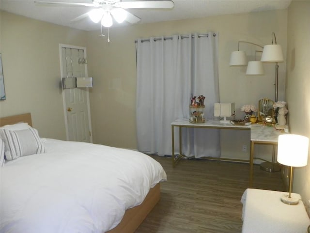 bedroom featuring wood finished floors and a ceiling fan