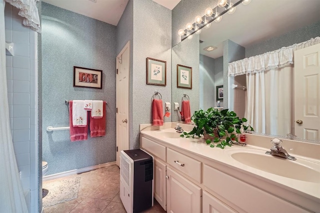 full bath with toilet, tile patterned floors, a shower with curtain, and a sink