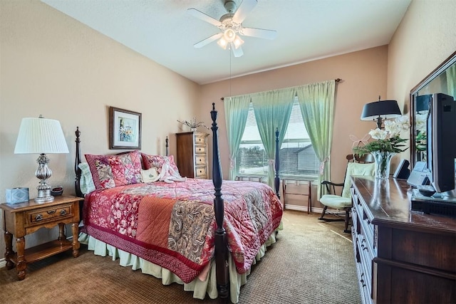 carpeted bedroom with baseboards and a ceiling fan