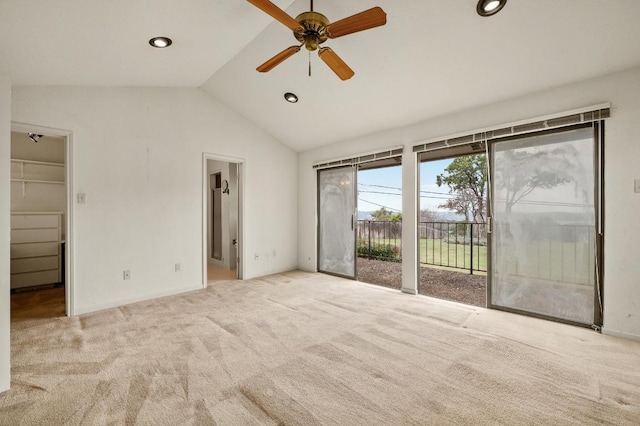 interior space with lofted ceiling, ensuite bathroom, carpet, access to outside, and a spacious closet