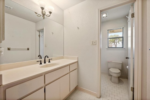 bathroom featuring visible vents, baseboards, toilet, tile patterned flooring, and vanity