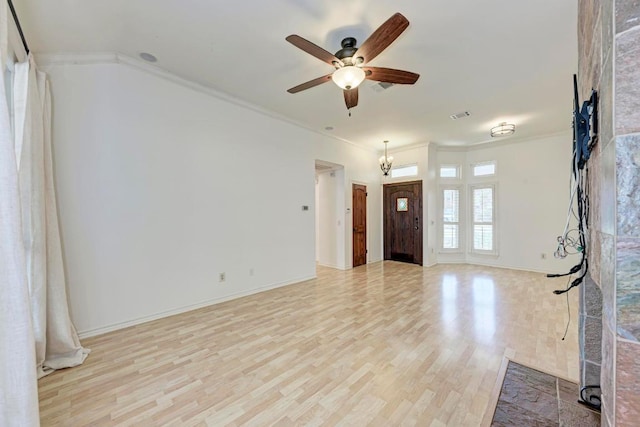 entrance foyer featuring baseboards, visible vents, light wood-style flooring, ceiling fan, and crown molding