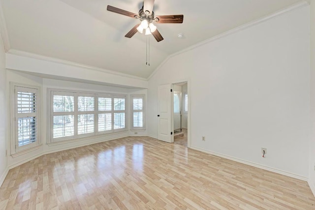 unfurnished room with crown molding, baseboards, vaulted ceiling, and light wood finished floors