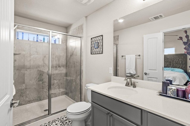 ensuite bathroom with a stall shower, visible vents, and ensuite bath