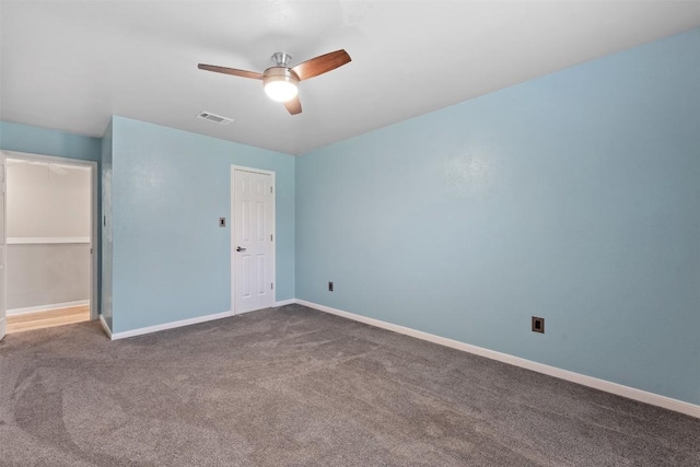 unfurnished bedroom with carpet, visible vents, ceiling fan, and baseboards