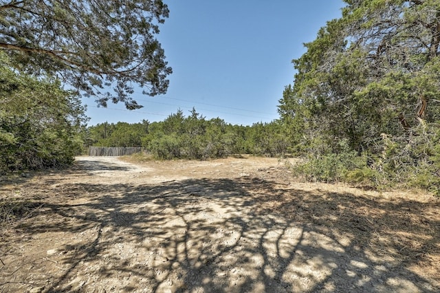 exterior space featuring a forest view