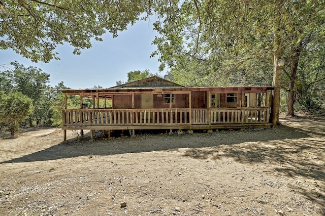 rear view of house with a porch