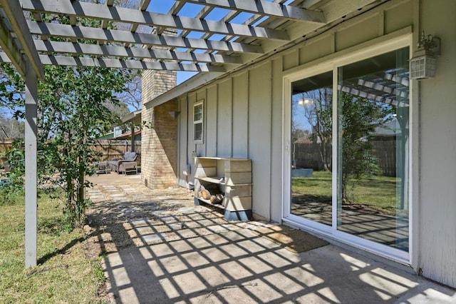 view of patio featuring fence and a pergola