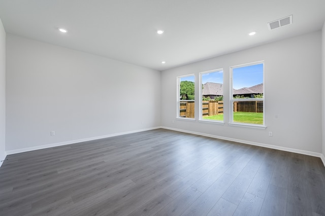 176 Pigeon River Rd, Kyle, TX 78640 - unfurnished room with dark wood-style floors, baseboards, and recessed lighting