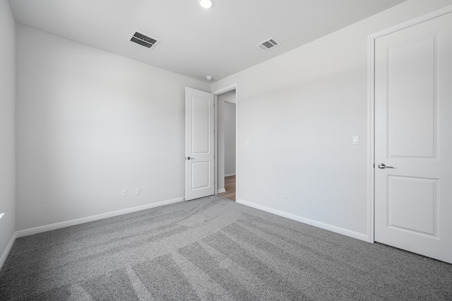 176 Pigeon River Rd, Kyle, TX 78640 - carpeted spare room with baseboards and recessed lighting