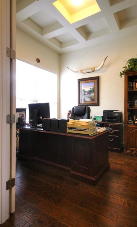 office area featuring dark wood-type flooring, coffered ceiling, and beamed ceiling