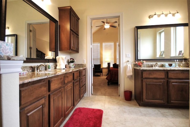 full bathroom featuring ensuite bath, two vanities, a sink, and tile patterned floors