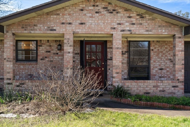 property entrance with brick siding