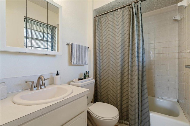 bathroom with vanity, shower / bath combination with curtain, and toilet