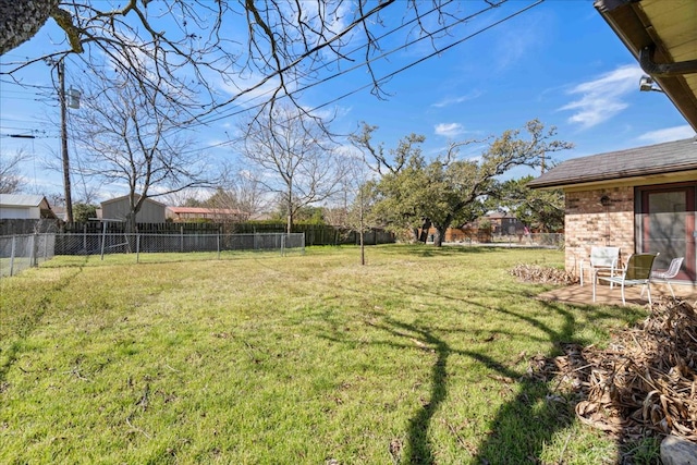 view of yard featuring a patio area and a fenced backyard