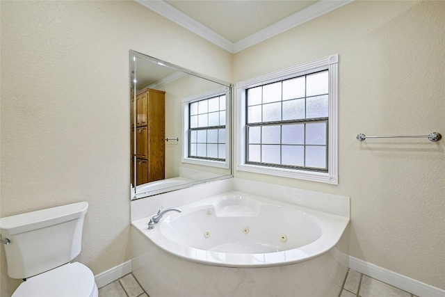 bathroom featuring toilet, ornamental molding, a jetted tub, baseboards, and tile patterned floors