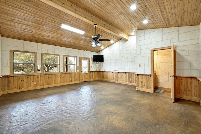 empty room featuring vaulted ceiling with beams, wood ceiling, concrete floors, and a ceiling fan