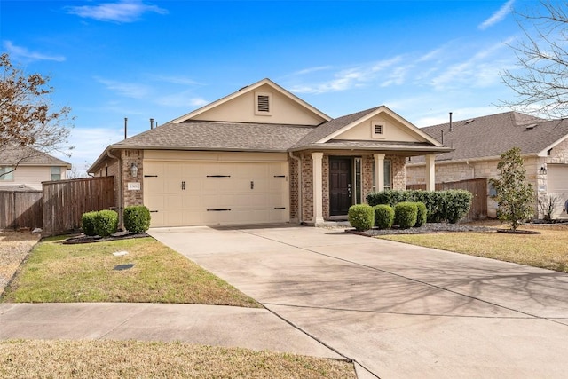 view of front facade with an attached garage, brick siding, fence, concrete driveway, and a front lawn